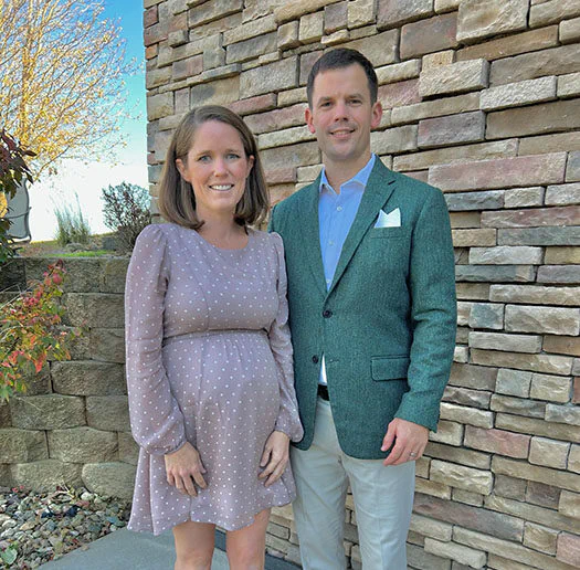 Dr. Sean Herschberger, implant dentist at Capital Smiles and his wife